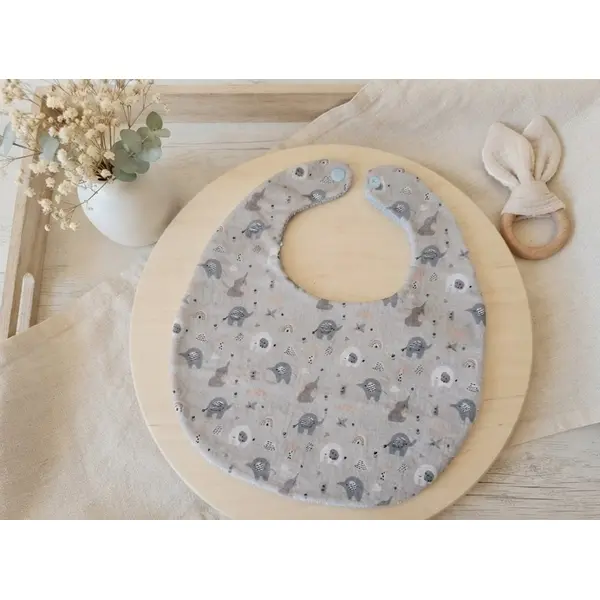 Bavoir bébé coton bleu motif éléphants et éponge bleue